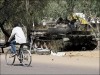 Chadian Army T-55 main battle tank picture . A Chadian soldier sleeps on his T55 tank in position in Ndjamena. Chad's government slapped a night curfew on Ndjamena and southern provinces as rebels who almost ousted President Idriss Deby Itno regrouped and rearmed after battling for the capital.