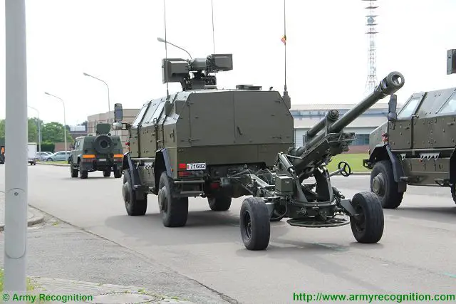 Belgian army LG1 105mm gun towed by Dingo 2 4x4 armoured vehicle