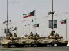 Russian T-72 heavy battle tanks from Kuwait's Armored Brigade, parade in Subhan, 40 kilometers east of Kuwait City, during a Kuwait Defense Ministry air show, Wednesday, March 11, 2009. Kuwait International Airport suspended all commercial air traffic for two hours during the parade, in which different kinds of military aircraft and helicopters took part on the occasion of celebrating National and Liberation Day. 