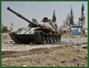 Syrian rebel fighters fought to control a key road to the Turkish border and turned captured tanks against a government air base north of Syria's largest city on Monday, July 30, 2012.
