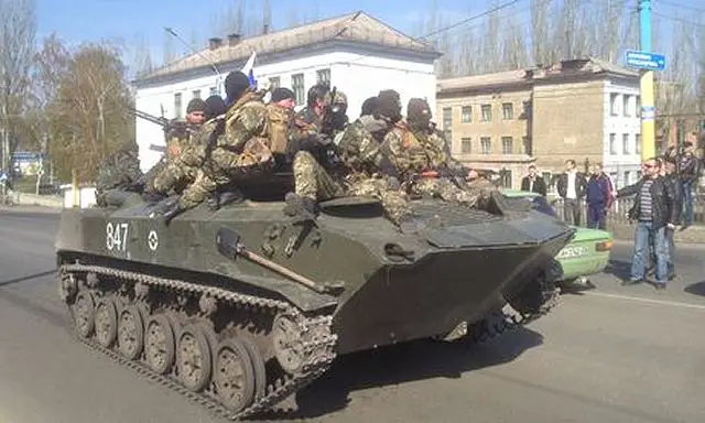 Pro-Russian armed separatists have seized five armoured personnel carriers BTR-D and a tank from the Ukrainian army, which they then drove in a victory lap through the centre of Kramatorsk in Ukraine's east, where government forces are attempting to wrest back control of the city.