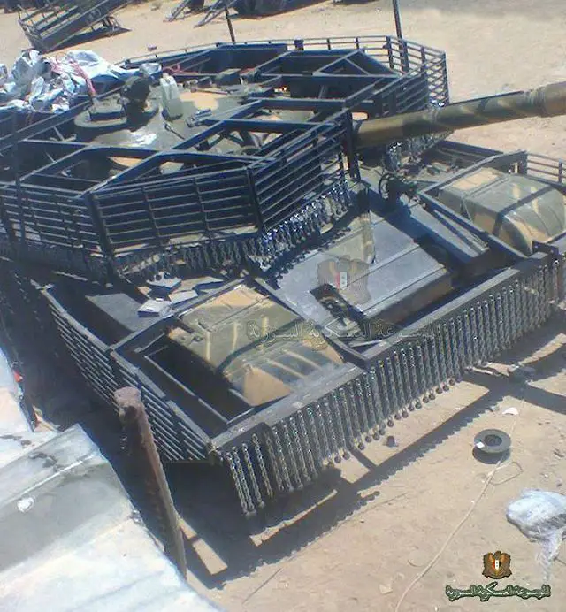 Syrian_army_tankers_to_upgrade_T-72M1_main_battle_tank_with_slat_armour_for_urban_warfare_640_002.jpg