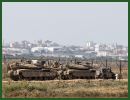 Israeli army has sent troops with tanks and artillery to the border with the Gaza Strip, raising the possibility of an expanded operation in the Palestinian territory in response to intensifying rocket fire. 