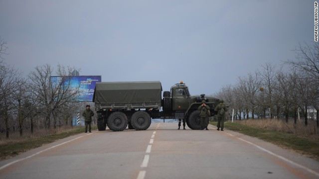 Russian troops blocked a road February 28 near the military airport in Sevastopol, Ukraine, on the Black Sea coast.