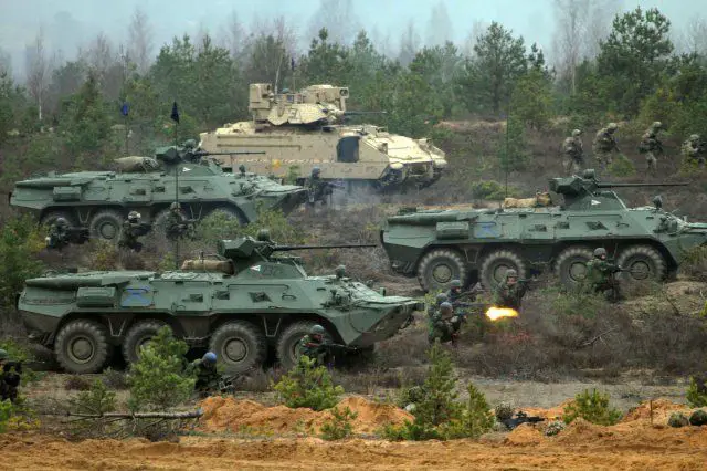 NATO was set Thursday to agree a major boost to the alliance's defenses near its Russian borders, including six command centers and a quick-reaction spearhead force of 5,000 troops in response to the crisis in Ukraine. Secretary General Jens Stoltenberg said ahead of a meeting of defense ministers in Brussels that the move was in response to Moscow's "aggressive actions," but nevertheless purely defensive. 