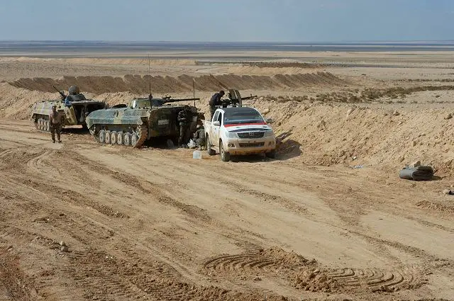 Syrian Arab Army soldiers on combat position near the city of Palmyra (© SPUTNIK/ MIKHAIL VOSKRESENSKIY) 
