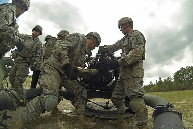 Artillerymen with 3rd Battalion, 319th Airborne Field Artillery Regiment, 1st Brigade Combat Team, 82nd Airborne Division, load a round into the Army's new all-digital M119A3 105 mm lightweight howitzer April 19, 2013, at Fort Bragg, N.C.