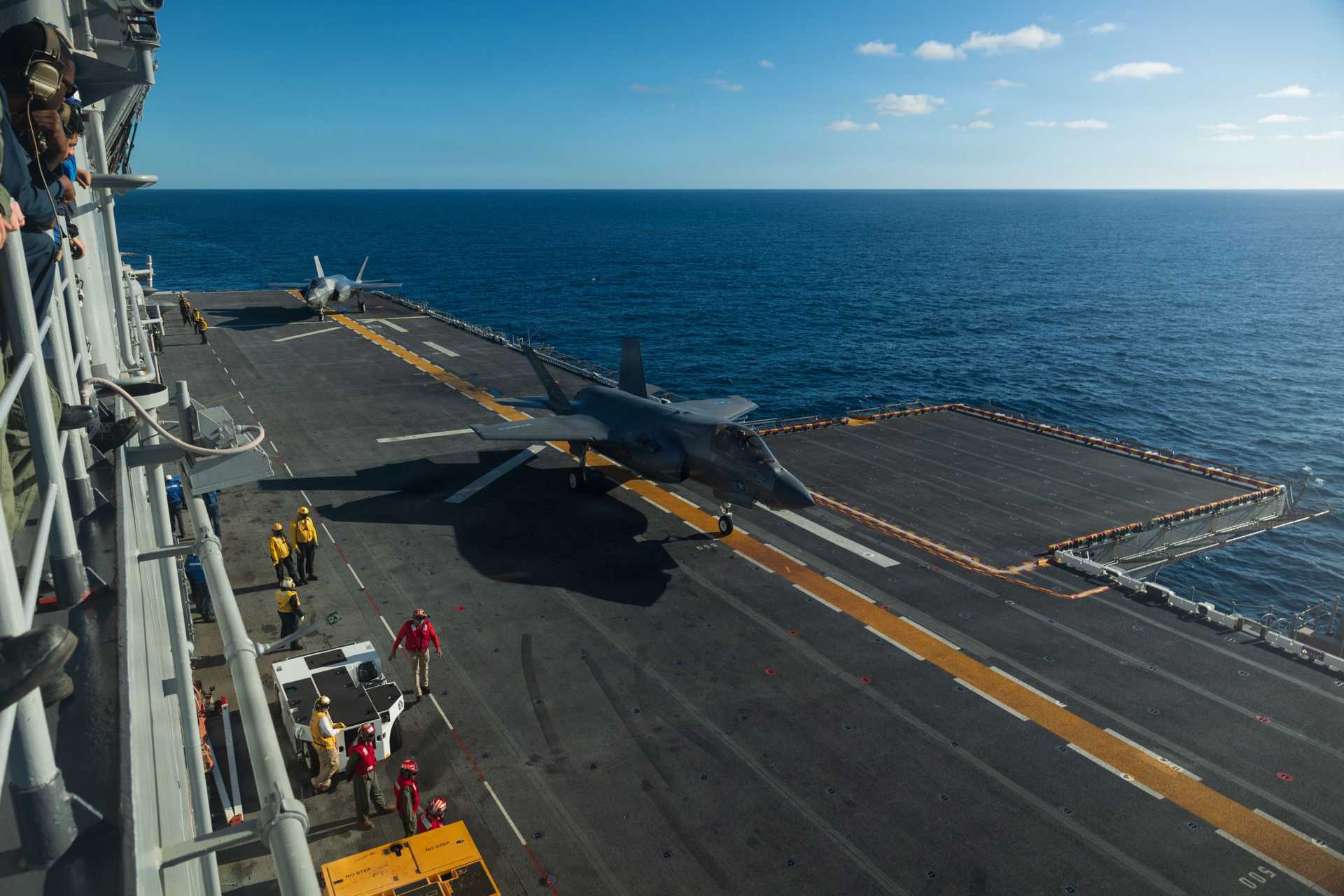 U.S. Marine Corps F-35B Lightning II fighter jets from Marine Fighter Attack Squadron 122 (VMFA-122), assigned to the 11th Marine Expeditionary Unit, are positioned on the flight deck of the Wasp-class amphibious assault ship USS Boxer (LHD 4) during operations in the Pacific Ocean on December 5, 2025.