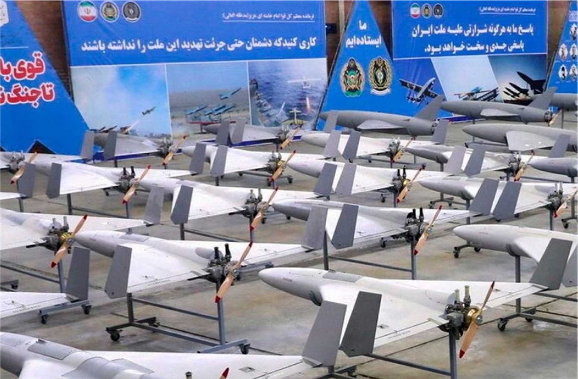 Iranian mass-produced attack drones prepared for launch, illustrating Tehran’s shift toward high-volume unmanned warfare to saturate U.S. and allied air defense systems during the ongoing 2025–2026 conflict.