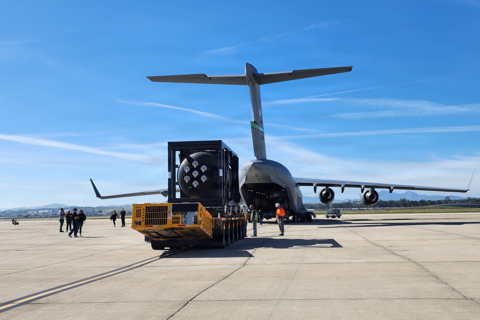 On February 15, 2026, U.S. Air Force personnel from the 452nd Logistics Readiness Squadron Aerial Port Flight at March Air Reserve Base in California loaded a next-generation nuclear reactor onto a C-17 Globemaster III as part of Operation Windlord. (Picture source: US DoD)