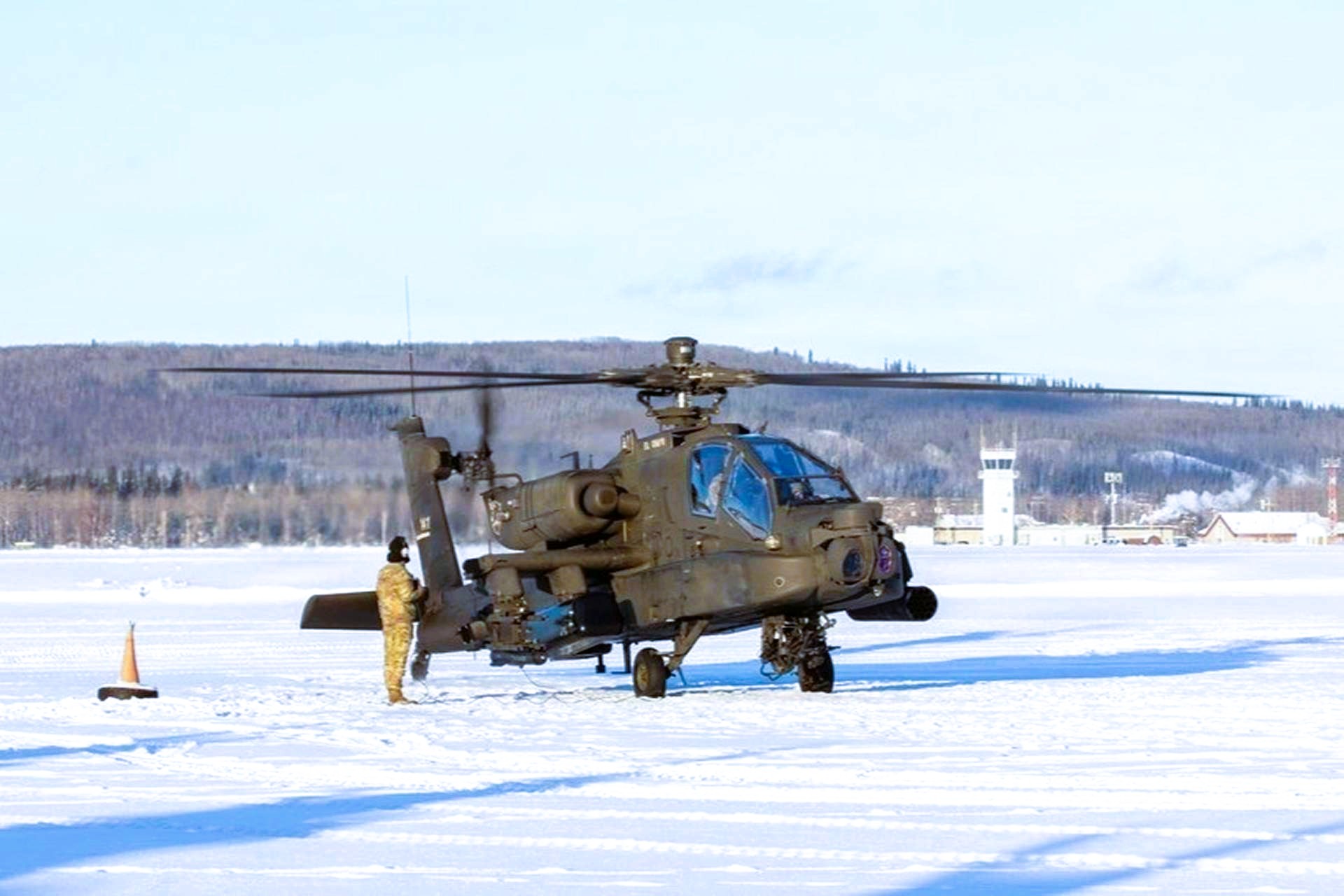 U.S. Army soldiers launched AH-64E Apache helicopters from snow-covered pads in Alaska during JPMRC 26-02, showcasing expanded Arctic combat aviation capabilities under extreme cold conditions (DVIDS)