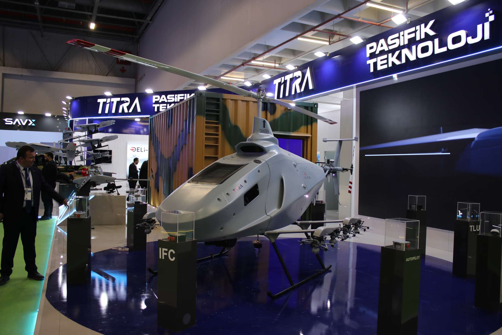 Turkish defense company Titra unveiled an Alpin unmanned helicopter carrying eight Merk&uuml;t FPV kamikaze drones at SAHA Expo 2026, showcasing a new airborne launch concept designed for NATO-style contested drone warfare (Picture Source: Army Recognition Group)