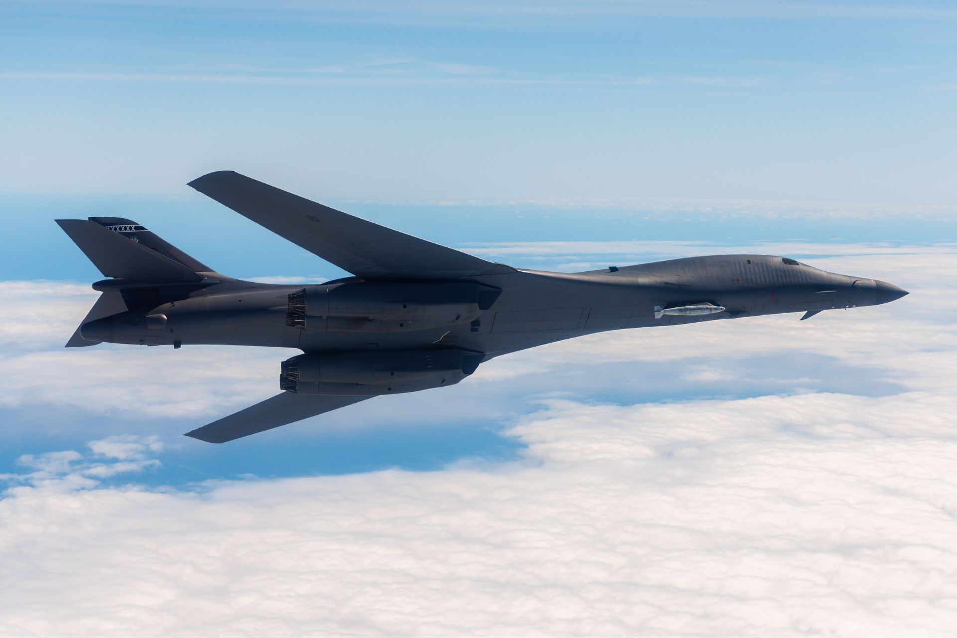 A 419th Flight Test Squadron B-1B Lancer tests the Load Adaptable Modular pylon over California in 2024.