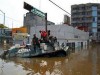 Mexican Army Navy personnel stand a top to amphibian armoured vehicles BTR-60 after it broke down on a flooded street in Villahermosa November 3, 2007. Thousands of people perched on roofs in southern Mexico on Saturday, desperate to be evacuated from flooding caused by heavy rains that has left most of Tabasco state under water and 800,000 people homeless.