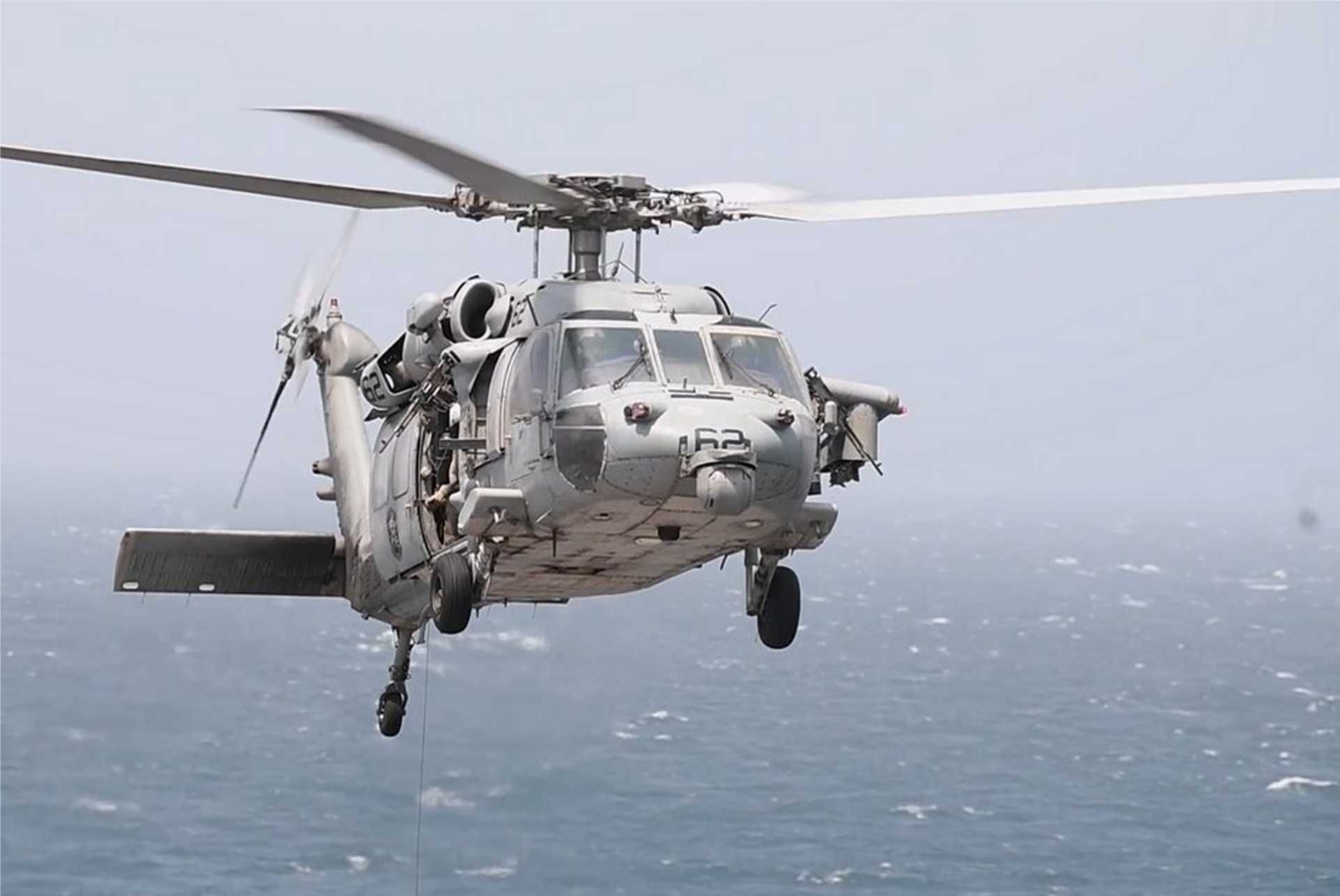 U.S. Navy MH-60R Seahawk armed with AGM-114 Hellfire missiles, illustrating the type of naval helicopter capability used by CENTCOM to intercept and disable the Panama-flagged cargo ship Vela Nova in the Gulf of Oman on August 11, 2026. The MH-60R can carry up to eight Hellfire missiles in a two-launcher configuration and combines maritime surveillance sensors with precision surface-strike capability.