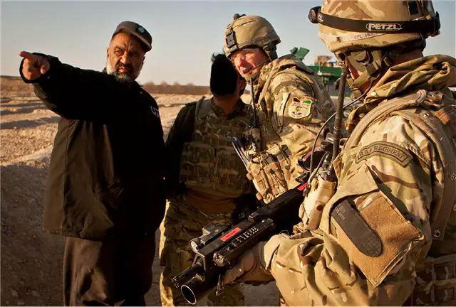 British Flight Lieutenant Tom Foskett liaises with an Afghan National Police explosive ordnance