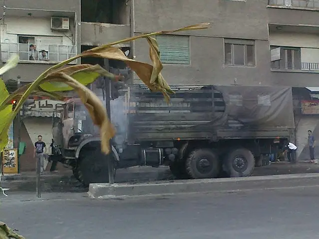 In Damascus, a witness in the central old quarter district of Qanawat said the huge headquarters of the Damascus Province Police was black with smoke and abandoned after being torched and looted in a rebel attack. 