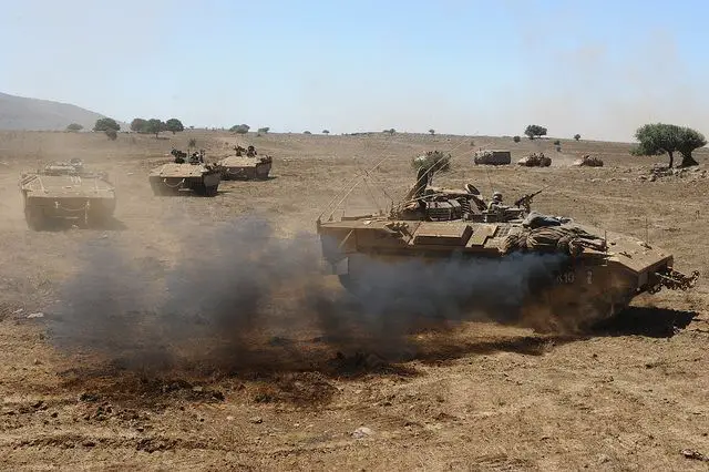 The 13th Battalion of the Golani Brigade during a drill held in the Golan Heights, northern Israel. The NAMER ("Tiger"), a new vehicle combining the artillery abilities of the Merkava tank and the APC's shielding capacities, was fully integrated in this drill for the first time, improving the battle tactics used by the IDF in the field.