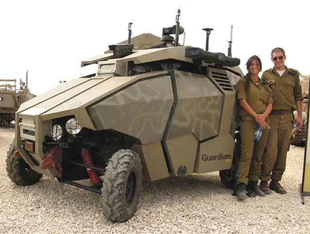 As the Guardium UGV takes its nightly patrol along Gaza’s border, the scene is quiet. Many miles away, a pair of operators scans the wide array of cameras, taking in 360 degrees of information. Suddenly, a red glow appears on the thermal cameras and slowly takes a human shape. Lights blare and confirm that someone is approaching the fence. A voice booms from the Guardium frightening the suspect. He cries out “is someone in there?” before thinking twice and running.