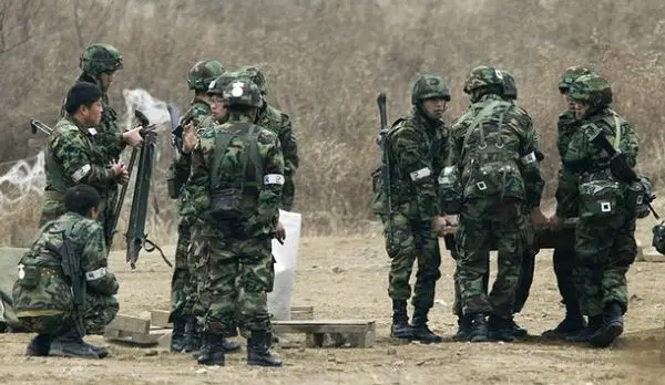 South Korea's intelligence chief is reported to have said that North Korea is very likely to attack again, a week after an artillery strike on a South Korean island. The revelation came hours after officials said Seoul was planning more military exercises with the US.   South Korean soldiers during exercise near the demilitarised zone separating the two Koreas 