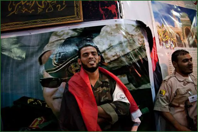 Libyan leader Colonel Muammar Gaddafi may still be in Tripoli as fierce fighting continues around his residence in the country’s capital, media reports said on Monday, August 22, 2011. Six months after a ragtag group of poorly trained rebels set out to topple the Libyan regime, the fighters appeared Monday to be on the brink of ending Moammar Gadhafi's 42-year rule. The loyalists control 15 to 20 percent of the city. 