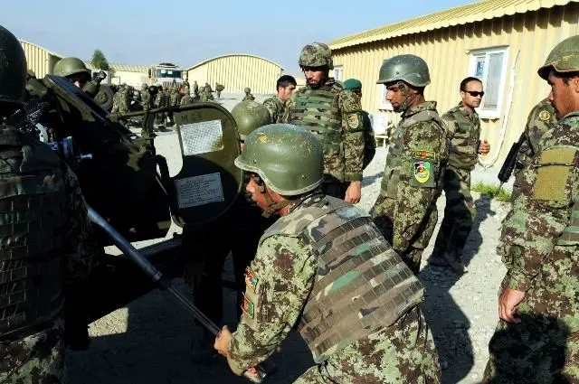An Afghan National Army artillerymen executes his portion of the crew drill, preparing to move the D30 howitzer at Forward Operating Base Gamberi, Dec. 3. 