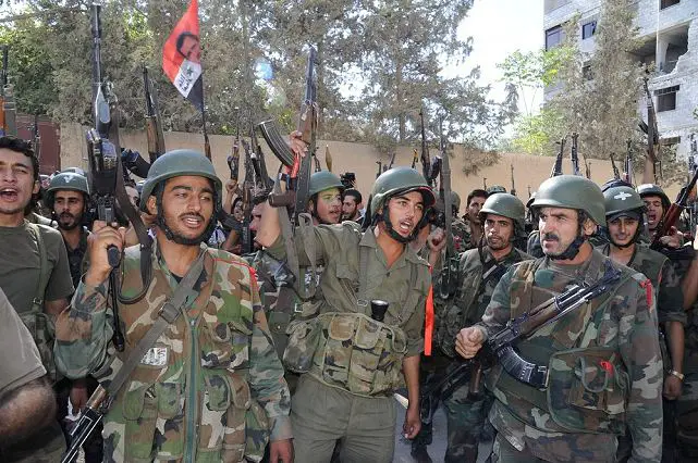Syrian army troops are deployed on August 4, 2012 in the Damascus suburb of Tadamun, the scene of heavy fighting earlier. The Syrian army now has the whole of the capital under its control, a brigadier-general told journalists visiting the southern neighbourhood which the general said was retaken by government forces in the afternoon, adding that it was the last rebel bastion in the city to revert to army hands. 