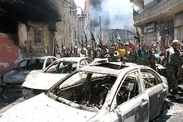Syrian state TV said Friday, July 20, 2012, that the government forces regained control of the restive Midan neighborhood of the capital Damascus, "cleaning armed terrorist groups there completely."
