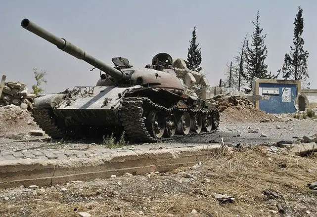 Syrian rebel fighters fought to control a key road to the Turkish border and turned captured tanks against a government air base north of Syria's largest city on Monday, July 30, 2012. The tanks came from the rebel seizure of an army outpost outside Aleppo, the scene of heavy fighting for more than a week. Rebel troops overran the outpost early Monday and were hauling out tank shells and crates of ammunition by afternoon.