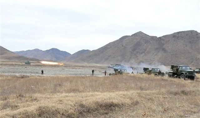 In this March 5, 2012 photo, the Second Corps of Korean People's Army in North Korea conduct a live-fire exercise with MRLS (Multiple Roclet Launcher System) in North Korea. 