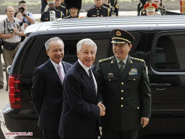Chinese State Councilor and Defense Minister Chang Wanquan (R) is welcomed by U.S. Secretary of Defense Chuck Hagel during their meeting in the Pentagon in Washington D.C. , the United States, on Aug. 19, 2013. 