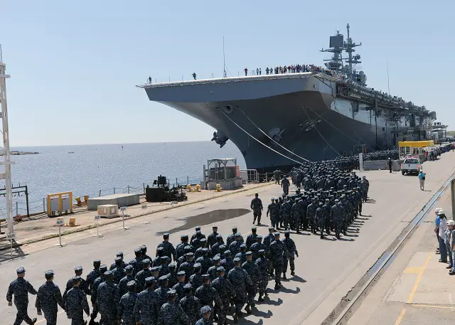 The U.S. Navy officially accepted delivery of the amphibious assault ship America (LHA 6) from Huntington Ingalls Industries during a ship custody transfer ceremony in Pascagoula, Miss., April 10. More than 900 Sailors and Marines assigned to Pre-Commissioning Unit (PCU) America marched to the ship to take custody on the flight deck.