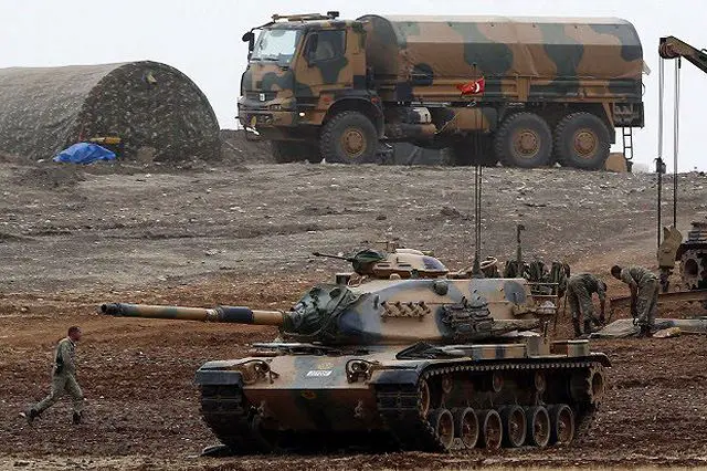 Turkish army tanks mechanized units take position on top of a hill near Mursitpinar border crossing (Photo:Canada)