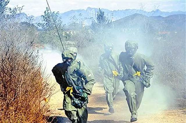 Chinese army soldiers wearing new individual protective masks, assigned to a chemical defense regiment with the 38th Group Army of the Chinese People's Liberation Army (PLA), conducted a chemical defense training exercise on decontaminating toxic chemical agents in late February, 2016. 