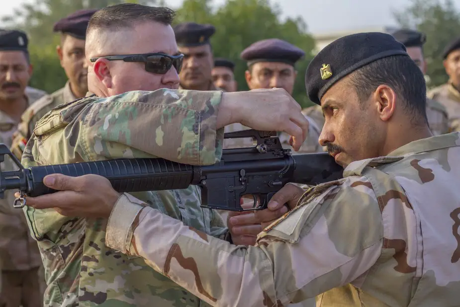 U.S. soldiers provide marksmanship tips to Iraqi army