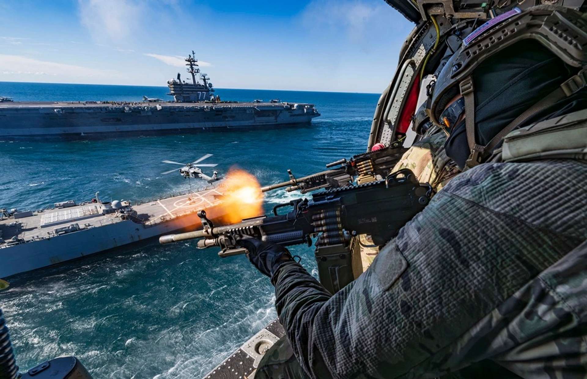 U.S. Navy SEALs Conduct Live Fire Operations From MH-60S Seahawks in a Carrier Defense Scenario