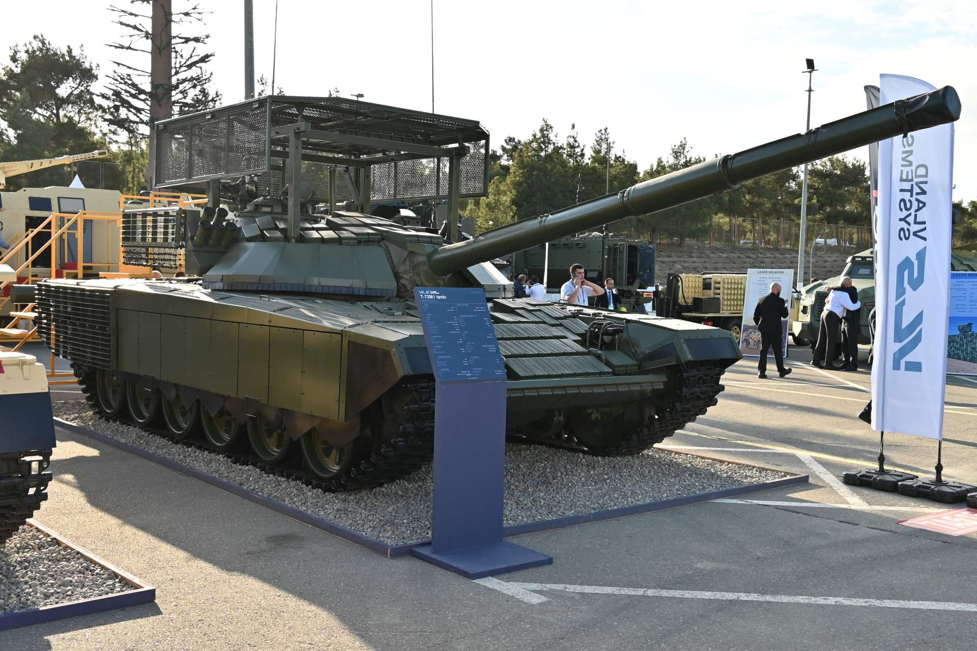 VLAND SYSTEMS unveiled a modernized T-72M1 tank at ADEX 2026 featuring upgraded optics, reactive armor and overhead protection designed to improve survivability against FPV drones and top-attack threats (Picture Source: Army Recognition Group)