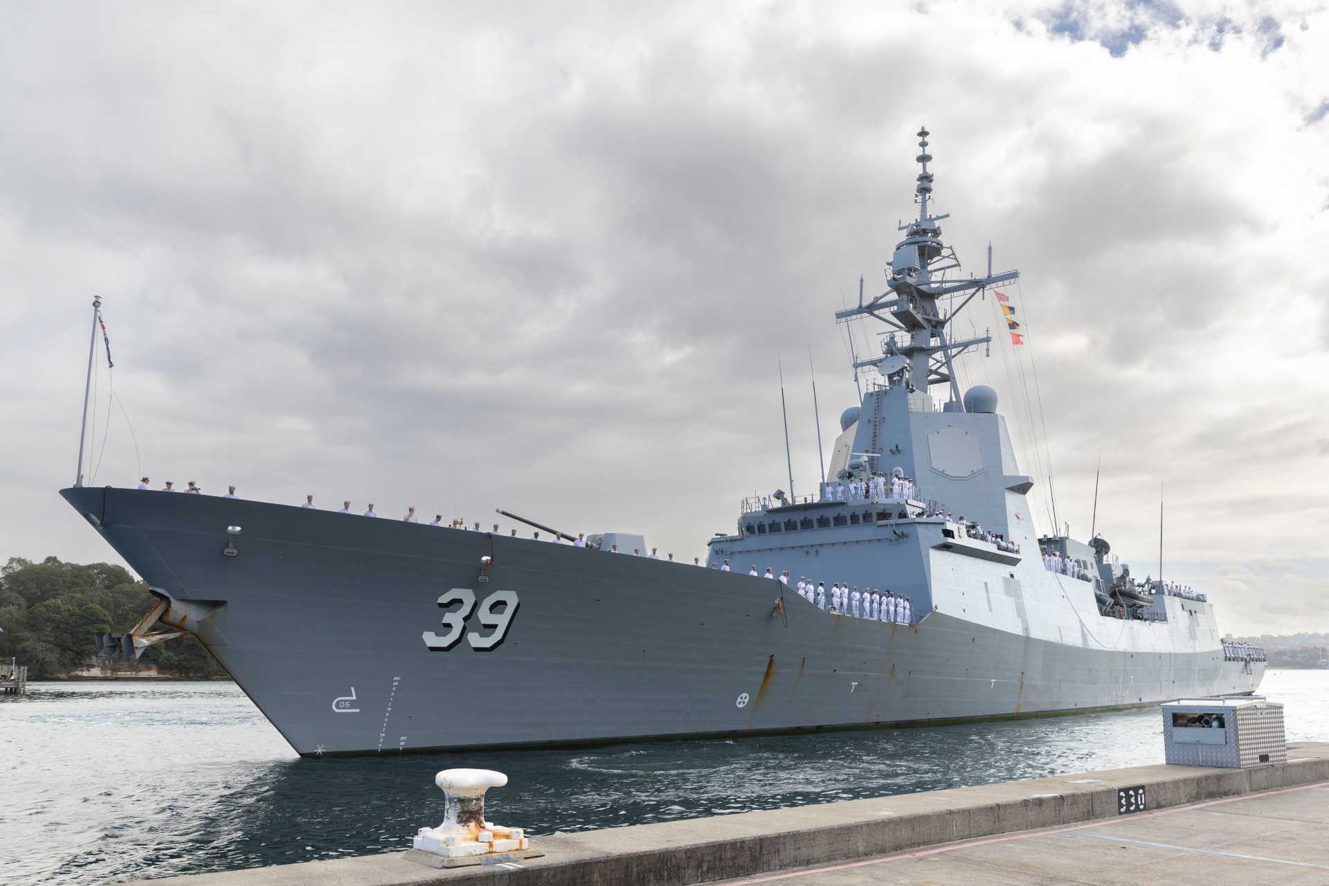 The Destroyer Capability Enhancement (DCE) transforms the HMAS Hobart from an air defence destroyer into a multi-mission combatant by adding Aegis Baseline 9 integrated missile defence, Tomahawk, SM-6, and NSM missiles, upgraded electronic warfare and communications, and a new Saab 9LV-based Australian combat-system interface. (Picture source: Australian MoD)