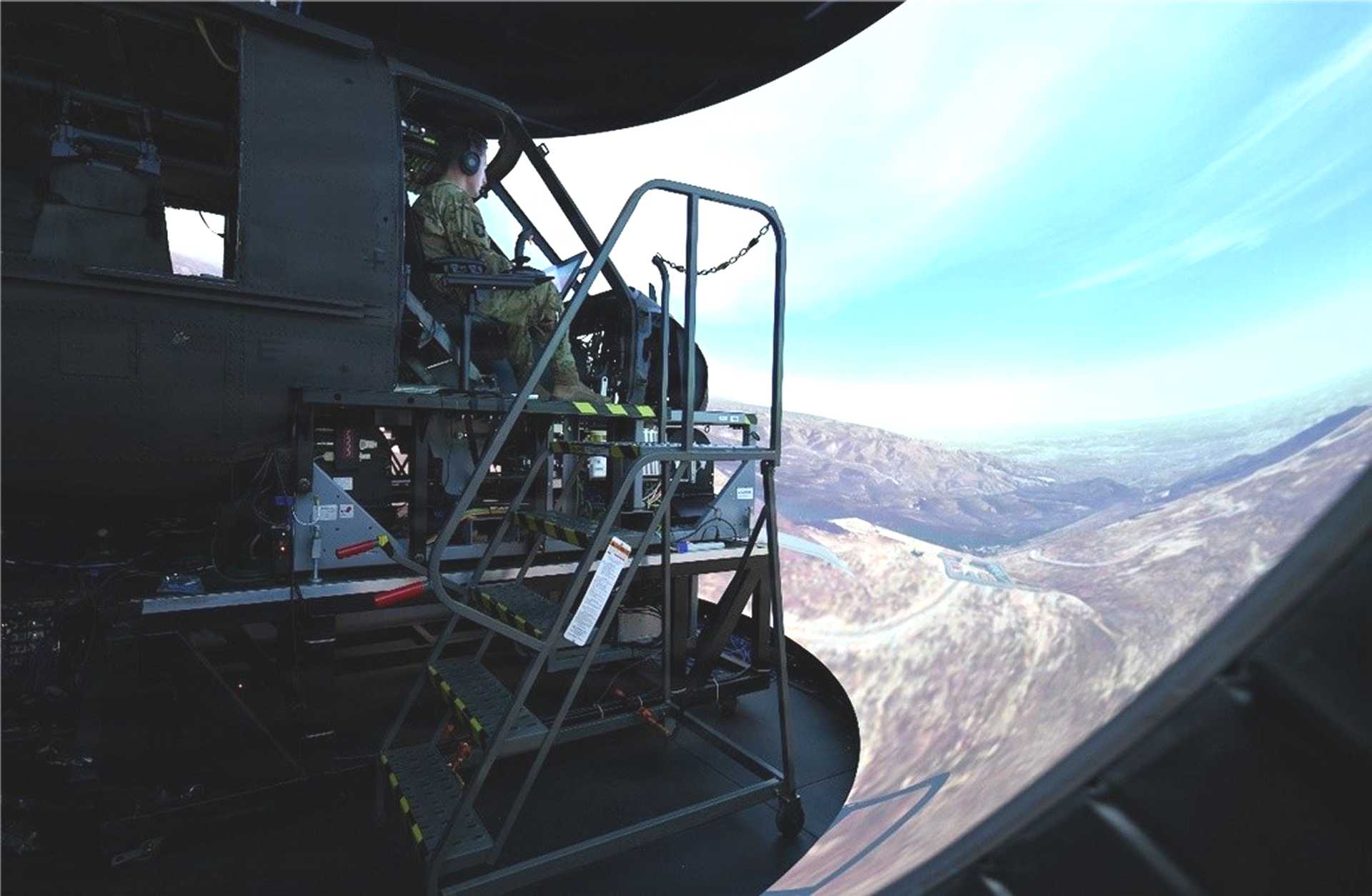 A U.S. Army aviator participates in the MV-75 Cheyenne Special User Evaluation inside the APEX2 flight simulator at Redstone Arsenal, where pilots assessed the next-generation tilt-rotor's digital cockpit to refine display design and reduce cognitive workload ahead of the aircraft's first flight. (Picture source: U.S. Army)