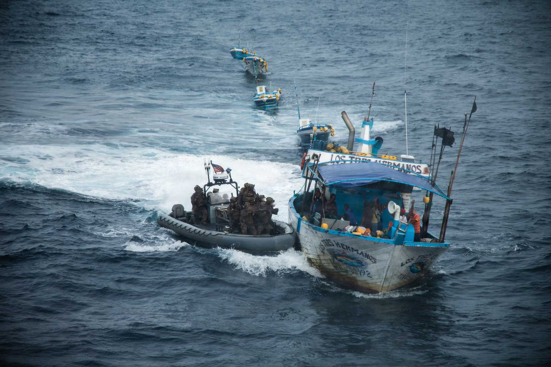  U.S. Marines with Littoral Combat Force-24 and U.S. sailors aboard the San Antonio-class amphibious transport dock USS San Antonio (LPD 17) prepare to board a vessel of interest during a Maritime Interdiction Operation in the Pacific Ocean on August 28, 2026.