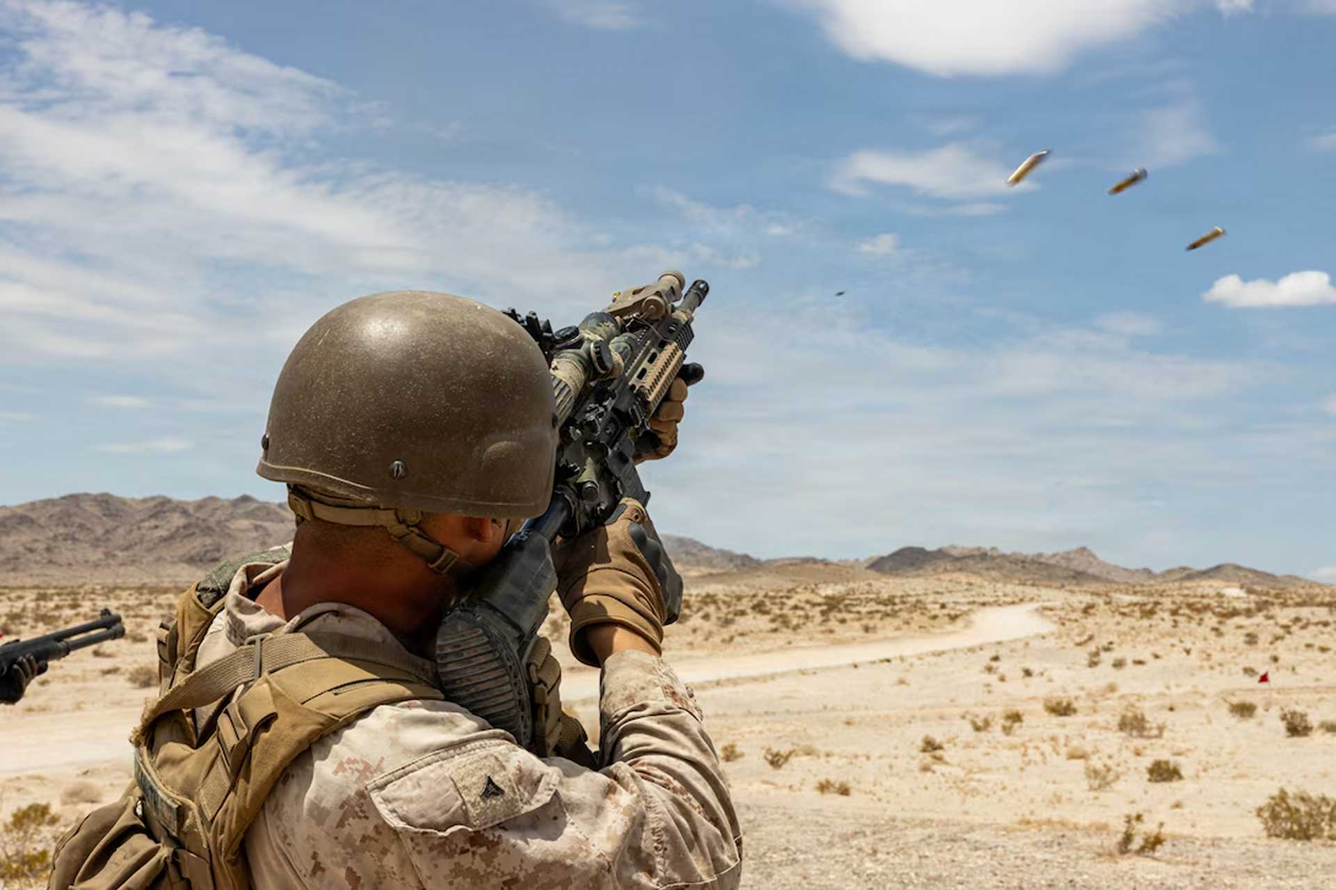 U.S. Marine Corps Lance Cpl. Jeremiah Smith fires an M27 Infantry Automatic Rifle during counter-drone training at Twentynine Palms, California, on July 17, 2026, as Marines practice engaging fast-moving small unmanned aerial systems at close range.