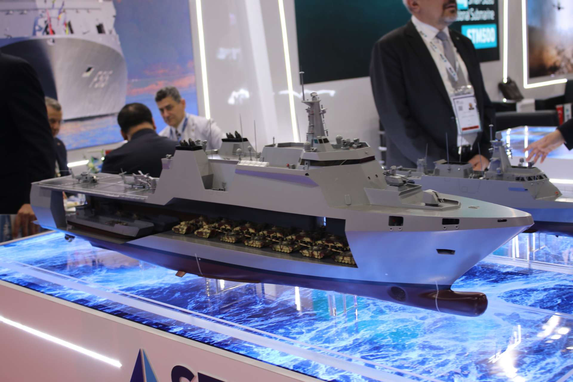 STM’s Multi-Role Support Ship (MRSS) model displayed at DSA in Kuala Lumpur, showcasing a medium amphibious support vessel designed for troop lift, vehicle transport, helicopter operations, and expeditionary logistics (Picture source: Army Recognition Group).