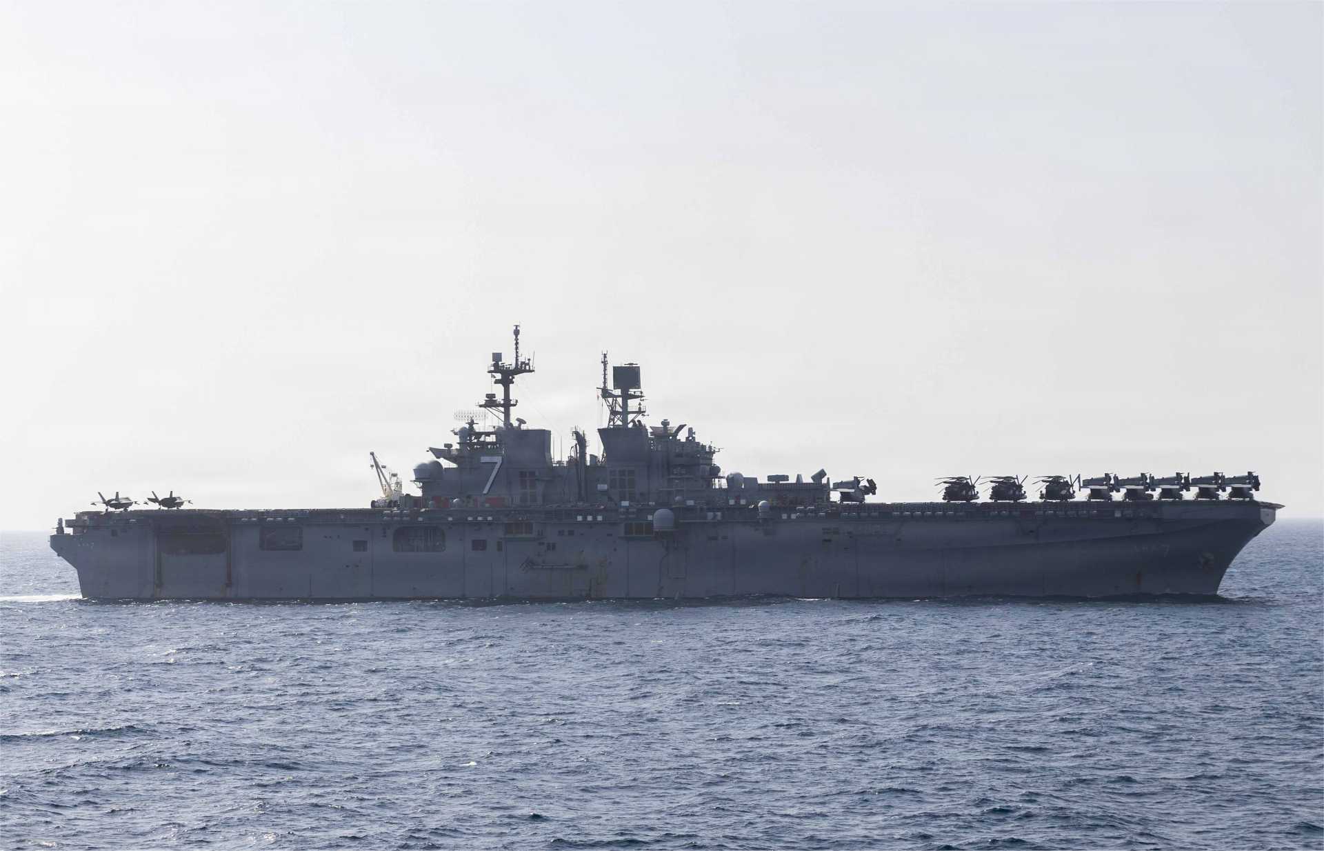 USS America (LHA-6), the lead ship of the U.S. Navy's America-class amphibious assault ships. Designed to support U.S. Marine Corps expeditionary operations, the class operates F-35B Lightning II fighters, MV-22B Osprey tiltrotors, and helicopters but does not use catapult launch or arrested recovery systems. (Picture source: U.S. Department of War/Defense)