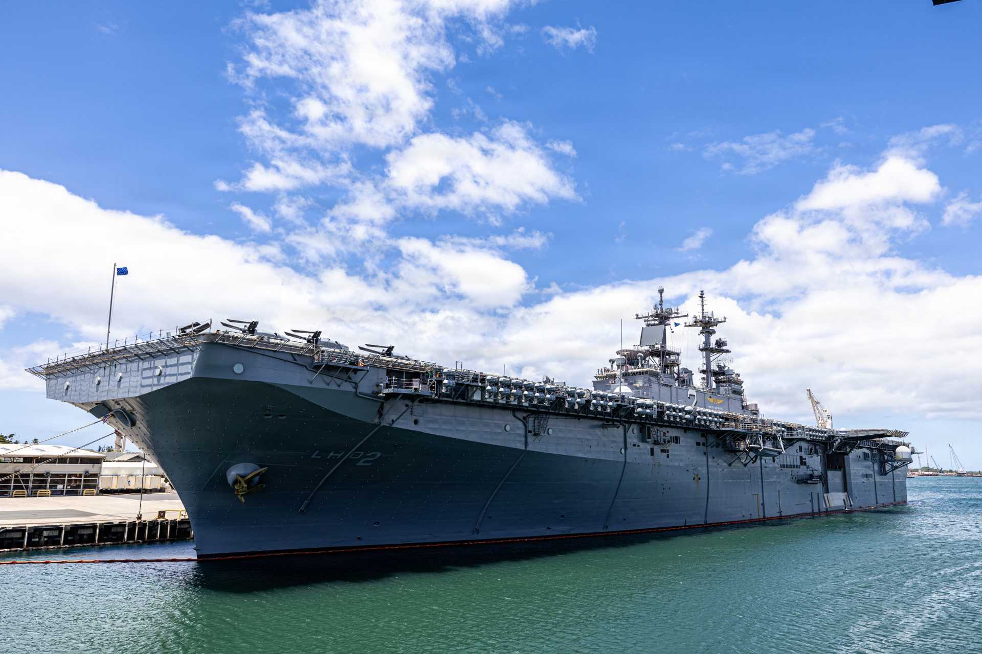 USS Wasp (LHD-1), the lead ship of the U.S. Navy's Wasp-class amphibious assault ships. Designed to deploy U.S. Marines, helicopters, MV-22B Osprey tiltrotors, and F-35B Lightning II fighters, the class combines aviation operations with a floodable well deck for landing craft and amphibious vehicles. (Picture source: U.S. Department of War/Defense)