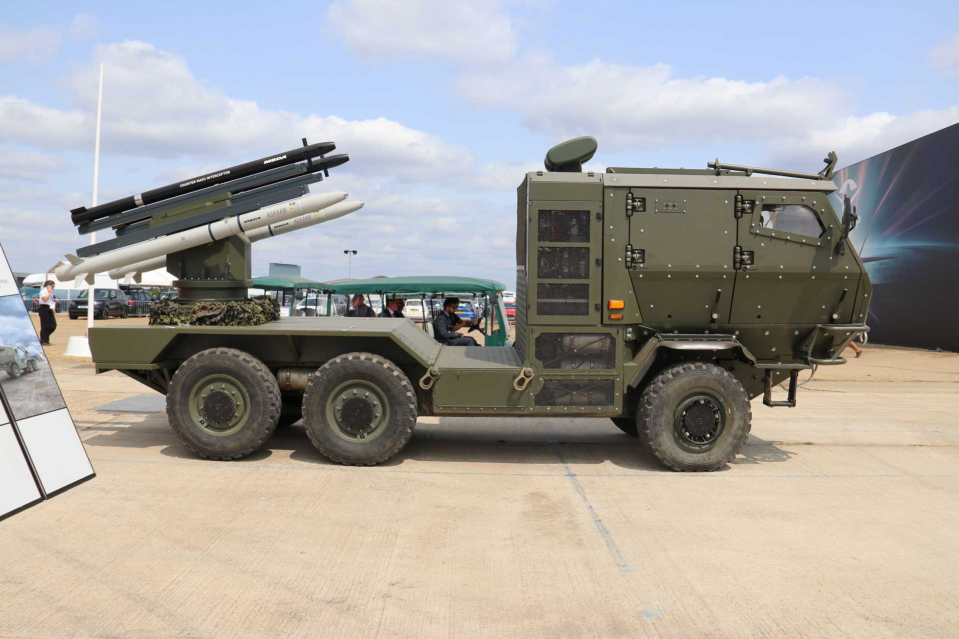 MBDA's new mobile counter-drone air defense system unveiled at Farnborough International Airshow 2026 combines the Counter Mass Interceptor (CMI) and SL-ASRAAM missiles on a Supacat high-mobility vehicle, providing a rapidly deployable layered defense against drones, helicopters, and cruise missiles.