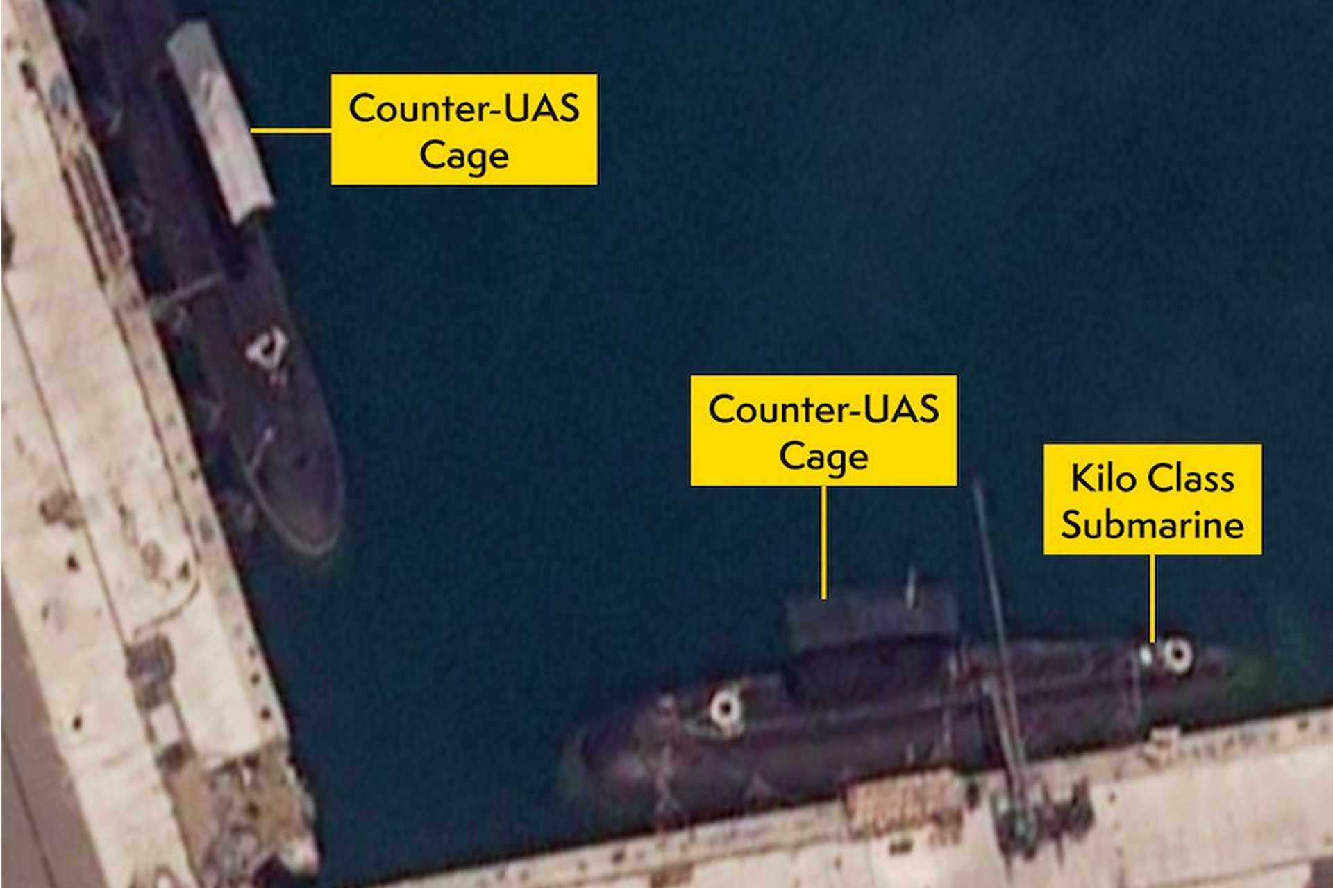 The cage installation is concentrated around the upper sail, which contains the periscopes, optronic sensors, antennas, communications masts, snorkel induction and exhaust arrangements, navigation radar, and access hatches. (Picture source: X/UK MoD)