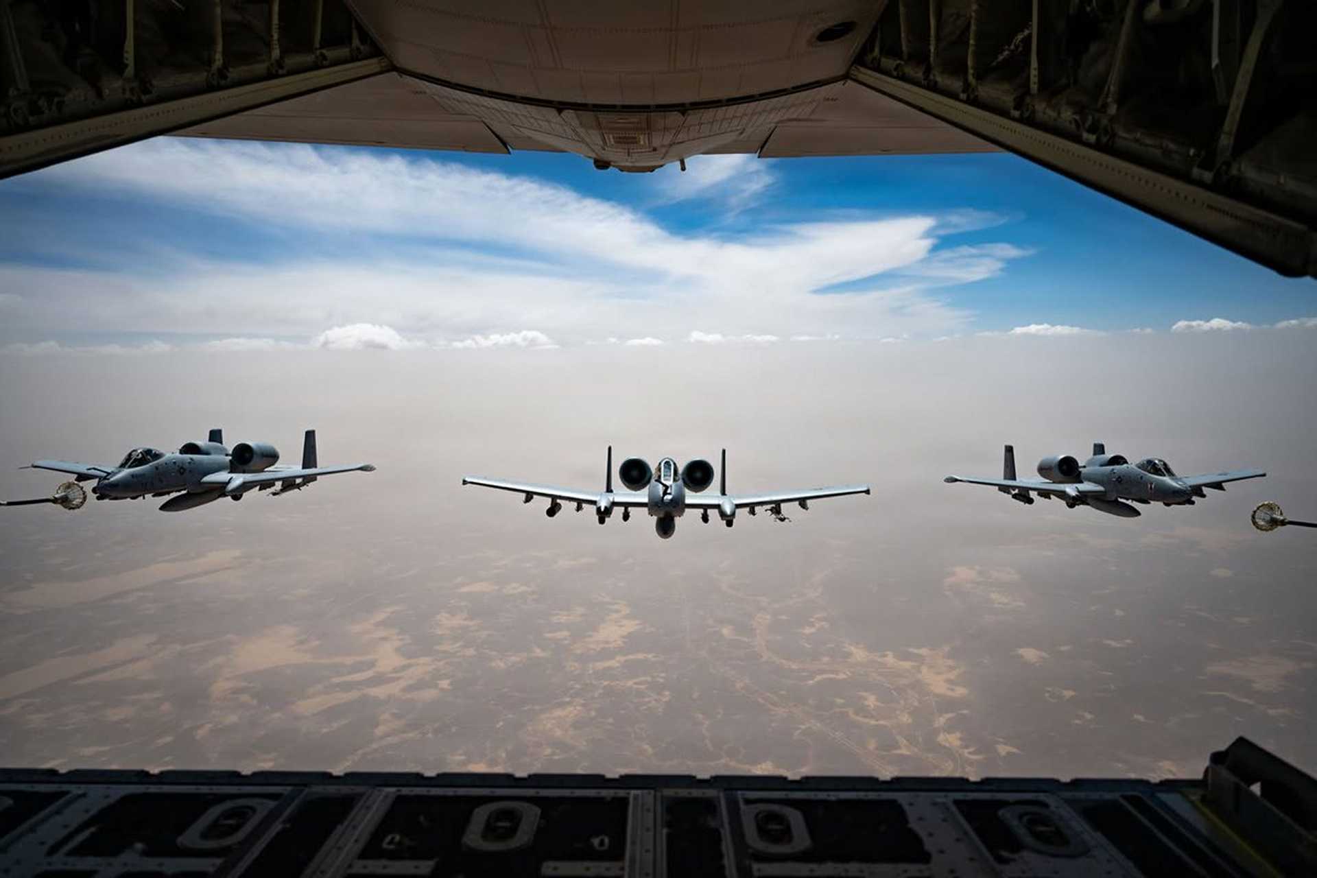 A U.S. Air Force HC-130J Combat King II conducts aerial refueling with three A-10C Thunderbolt II attack aircraft during operations in the U.S. Central Command area of responsibility, extending the aircraft's endurance and operational reach. (Picture source: U.S. CENTCOM)