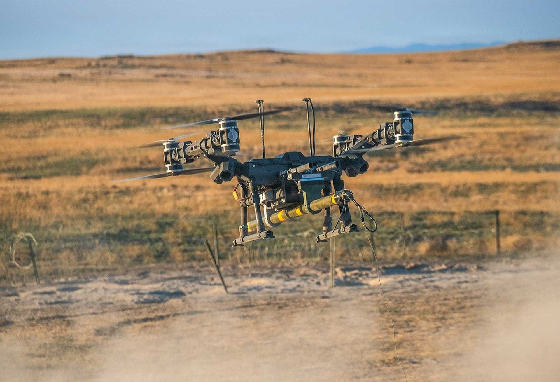 A Lorica Technologies Mule 28 heavy-lift unmanned aerial vehicle delivers a live M1A3 Bangalore torpedo during a U.S. Army proof-of-concept demonstration to breach concertina wire obstacles at Orchard Combat Training Center, Idaho, on June 22, 2026.
