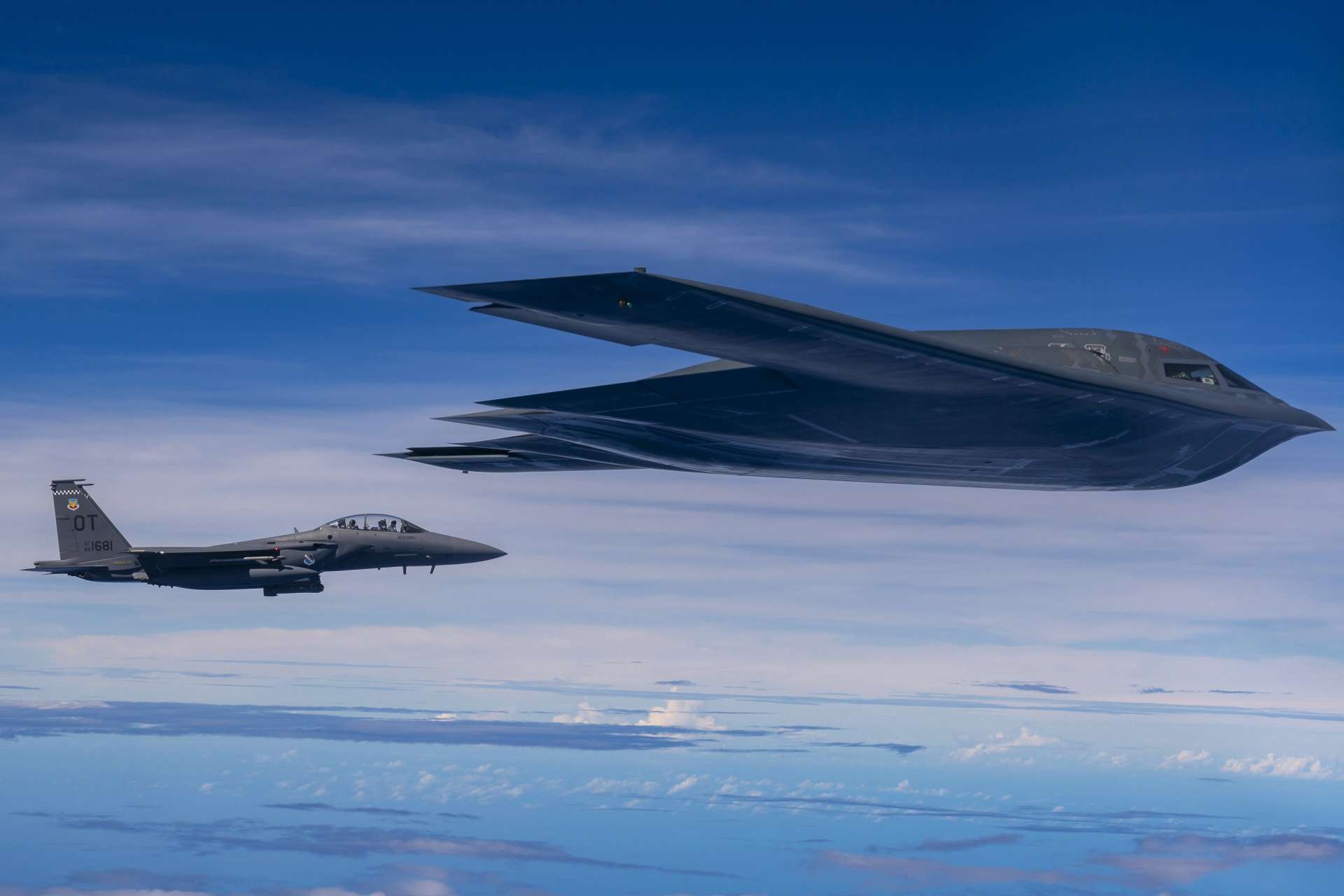 A U.S. B-2 Spirit firing LRASM alongside an F-15E over the Philippine Sea signals a sharper U.S. push to build long-range, stealth-enabled sea-denial power across the Indo-Pacific (Picture Source: U.S. Air Force)
