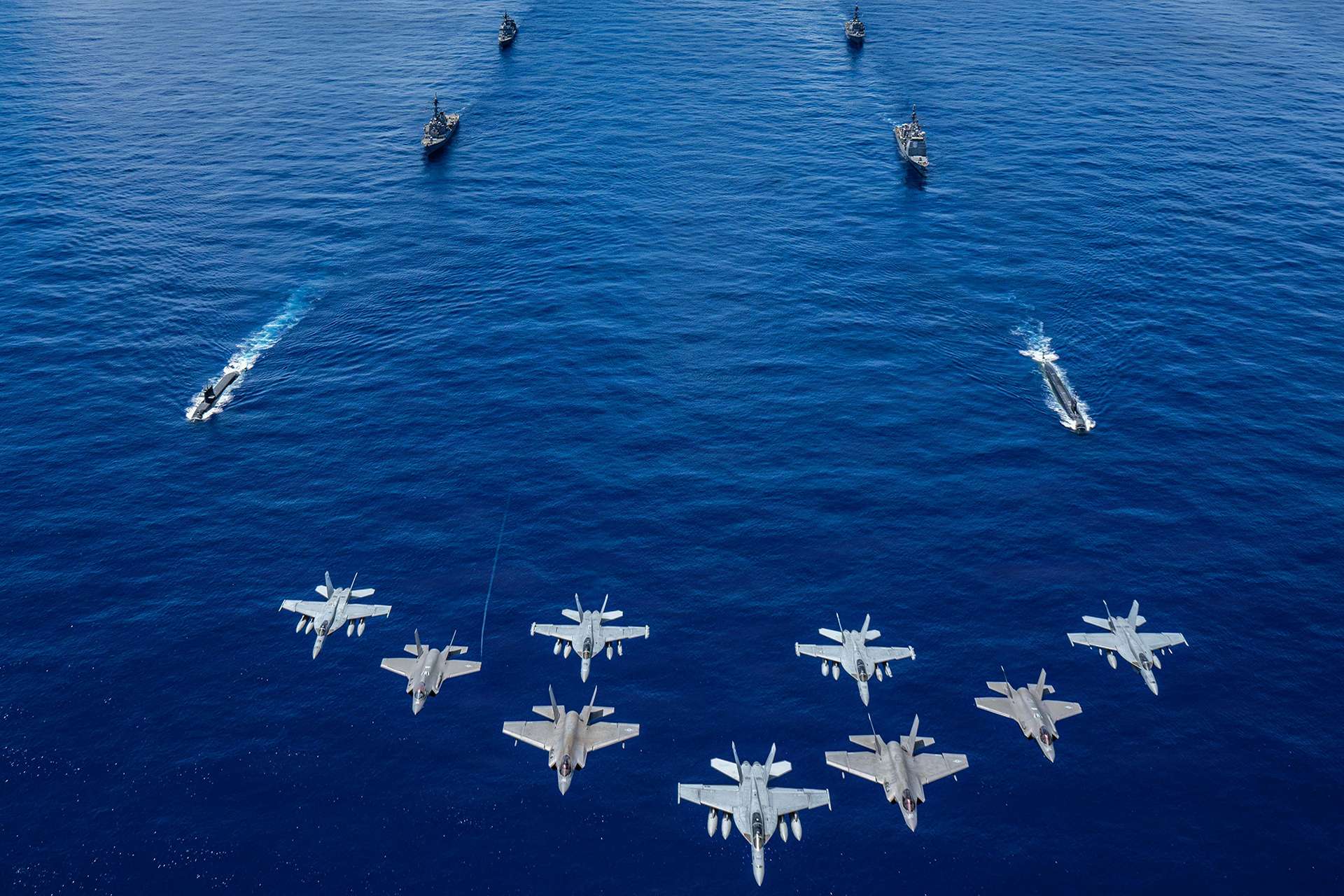 Lockheed Martin demonstrated software-driven command and control during Valiant Shield 2026, linking Aegis Guam, AN/TPY-6, THAAD, C2BMC, IBCS, and other air and missile defense systems to improve threat evaluation, interceptor assignment, and Guam’s layered defense against ballistic, cruise, hypersonic, and air-breathing threats (Picture source: U.S. DoW).